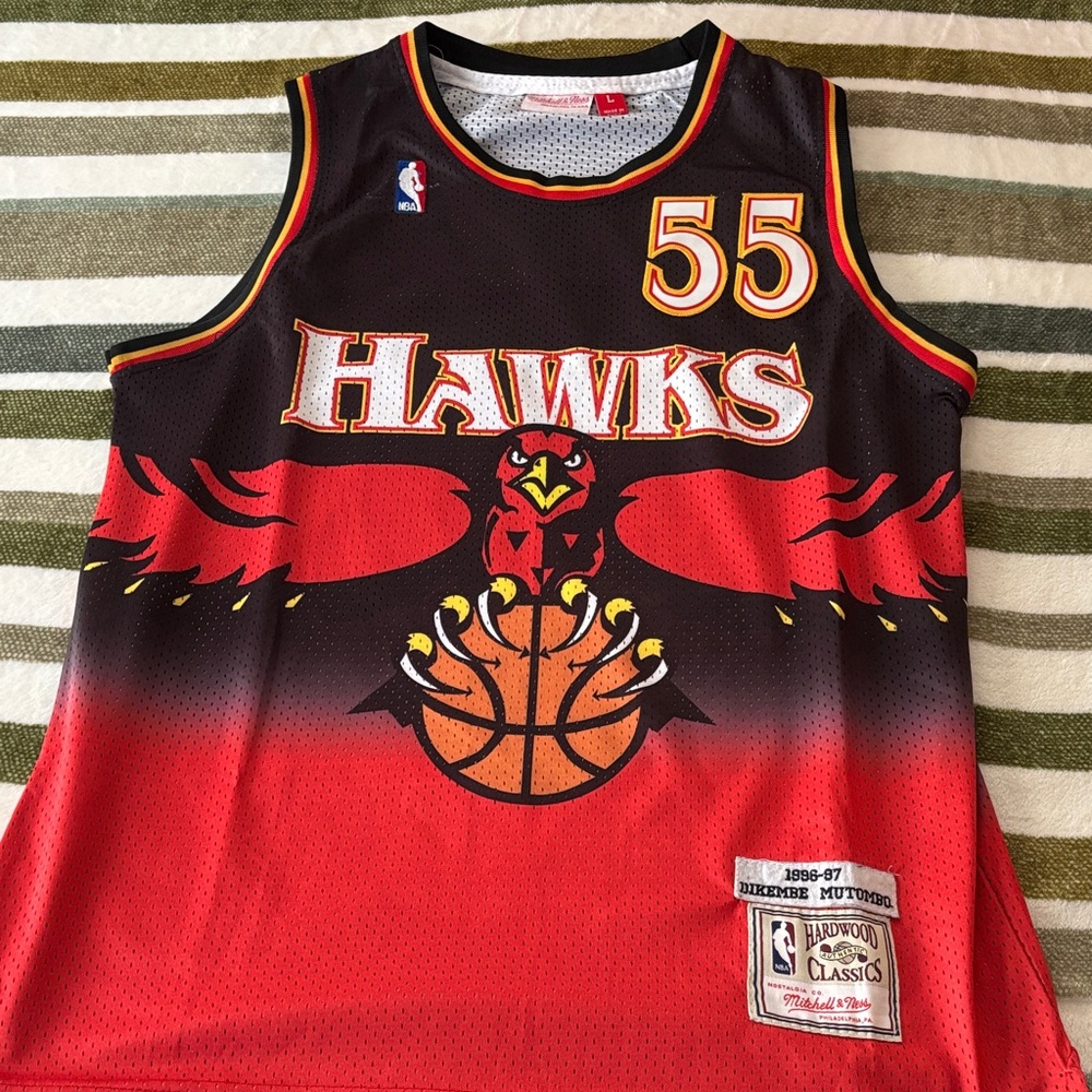Hawks Mutombo Basketball Jersey with Red and Black Design